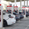 Kettleman City, CA - Jan 29, 2022: Many cars charging at a Tesla Supercharger station. Supercharger stations allow Tesla cars to be fast-charged at the network within a hour.