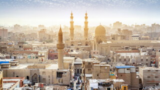 CAIRO, EGYPT - OCTOBER 12, 2018: Panorama of the medieval Bab Zuweila gate located in the heart of Islamic Cairo and surrounded by noisy Arab souq (market), on October 12 in Cairo.