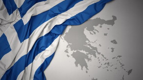 waving colorful national flag and map of greece.