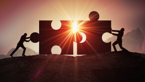 Teamwork, partnership and cooperation concept. Silhouettes of tw