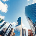 Modern tower buildings or skyscrapers in financial district with cloud on sunny day in Chicago, USA. Construction industry, business enterprise organization, or communication technology concept