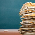 Stack file folders with documents on the desk