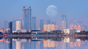 Mumbai is the financial and entertainment capital of India - Construction crane and skyscraper at sunset "Elements of this image furnished by NASA"