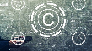 Copyright concept with businessman holding a tablet