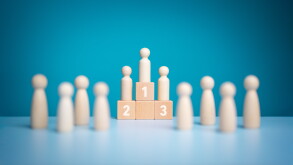 Business hierarchy, Wooden figures peg dolls standing on the podium 1st, 2nd, and 3rd positions of wooden cube blocks with copy space. Ranking and strategy concept. Success or ranking ideas.