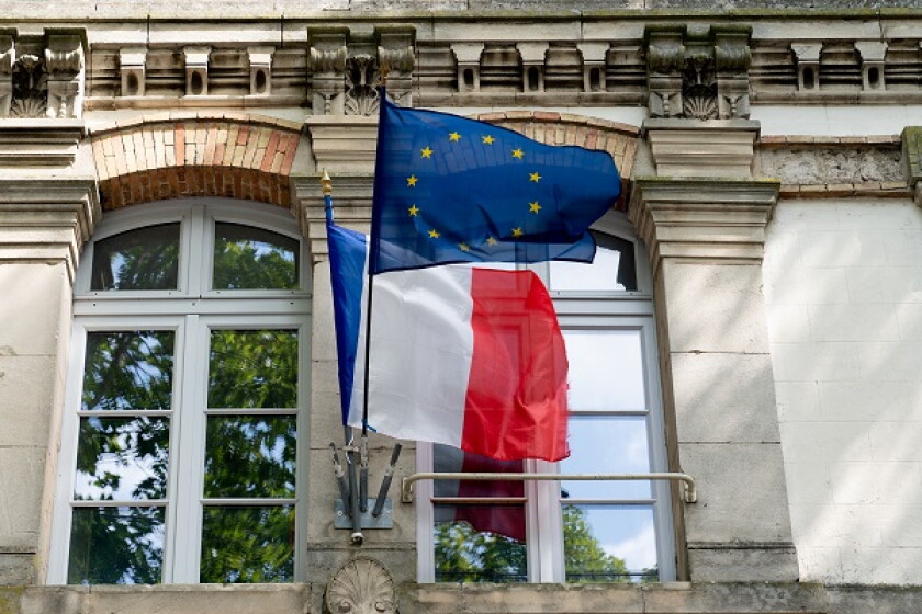 French and EU European Union flags fluttering on the city hall i