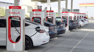 Kettleman City, CA - Jan 29, 2022: Many cars charging at a Tesla Supercharger station. Supercharger stations allow Tesla cars to be fast-charged at the network within a hour.