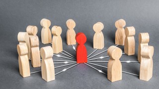 The red person is connected with employees by wide network of lines. At the center of a complex large system. Communication social. Cooperation, collaboration. Project leadership personnel management